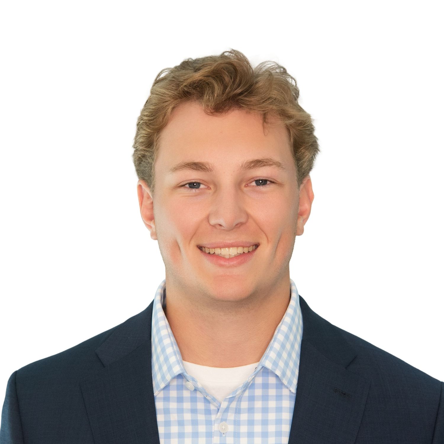 A headshot portrait of a young man wearing a suit and tie photographed by Leah Ramuglia Photography.