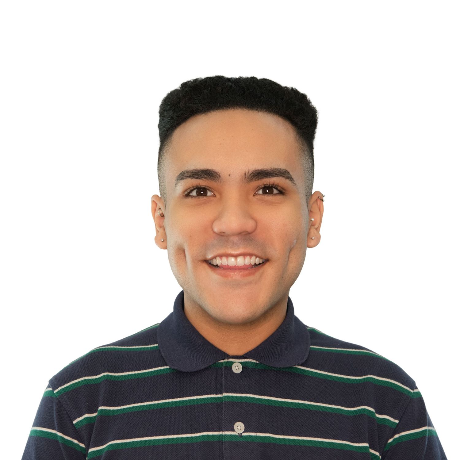 Smiling person wearing a navy striped polo shirt against a white background in professional headshots with Leah Ramuglia Photography.