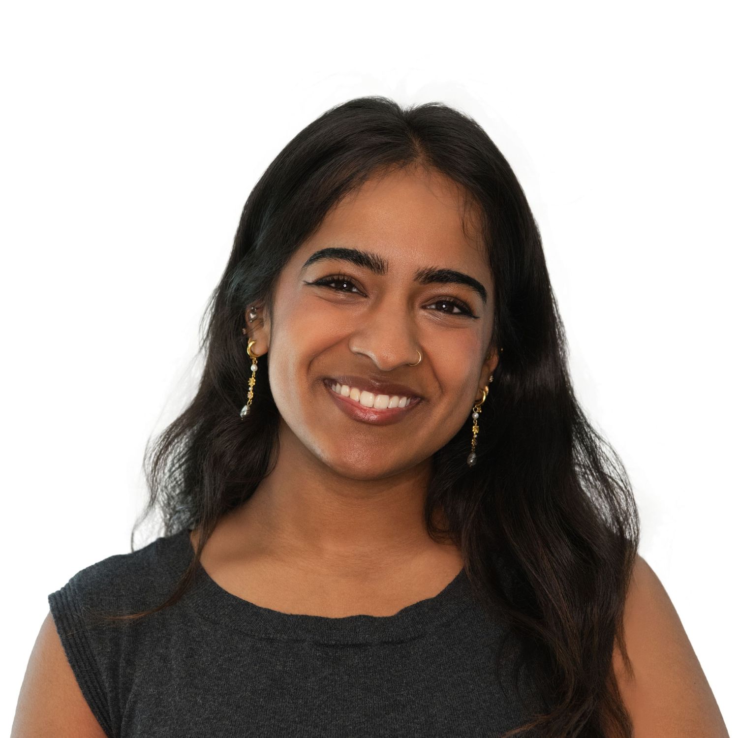 Smiling woman with long dark hair wearing a black top poses in a series of headshots at her Boston office with Leah Ramuglia Photography.