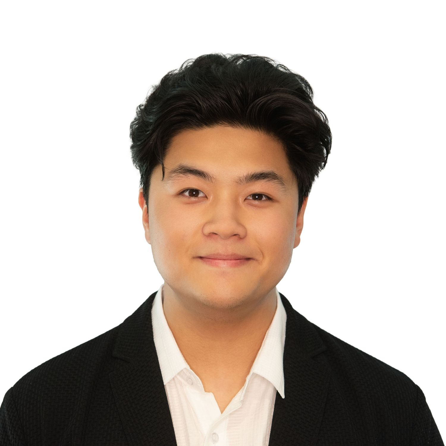 Professional headshot of an intern in a black suit jacket & white dress shirt smiling against a white background by Leah Ramuglia Photograph