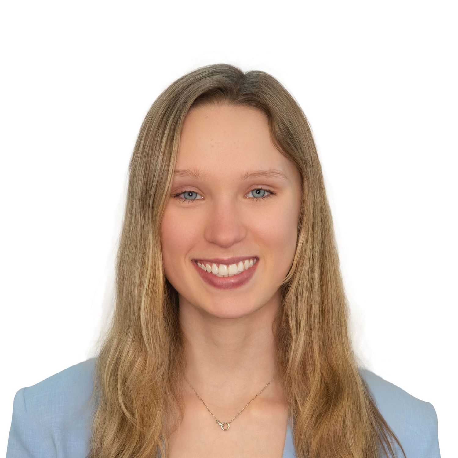 Professional women’s headshots in Boston, MA with Leah Ramuglia Photography for this blonde woman in a light blue blazer.