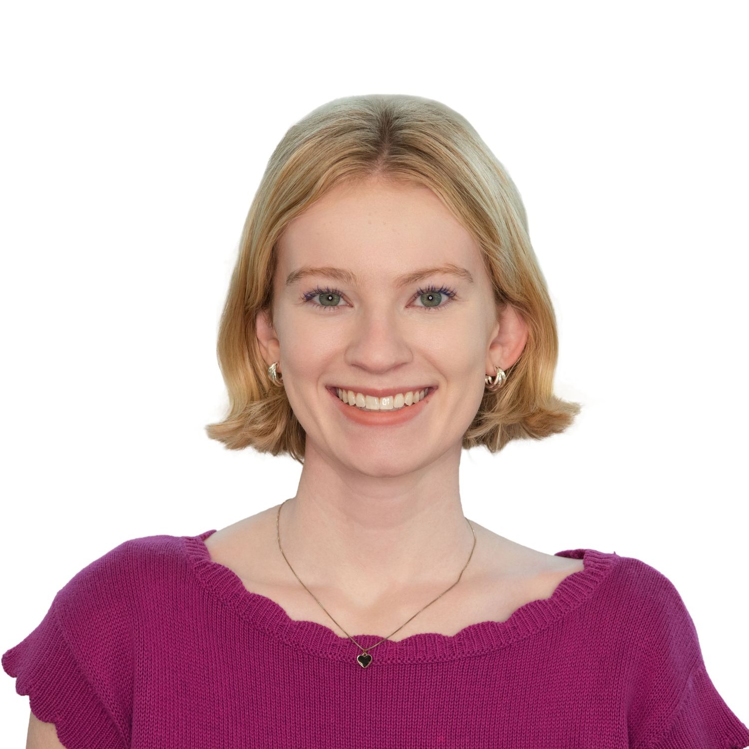 Professional headshot of a woman in a pink blouse at an office in Boston, photographed by Leah Ramuglia Photography.