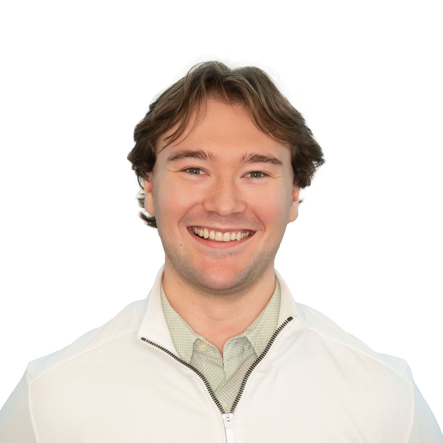 A person wearing a light-colored shirt smiles warmly at the camera in a professional headshot with Leah Ramuglia Photography in Boston.