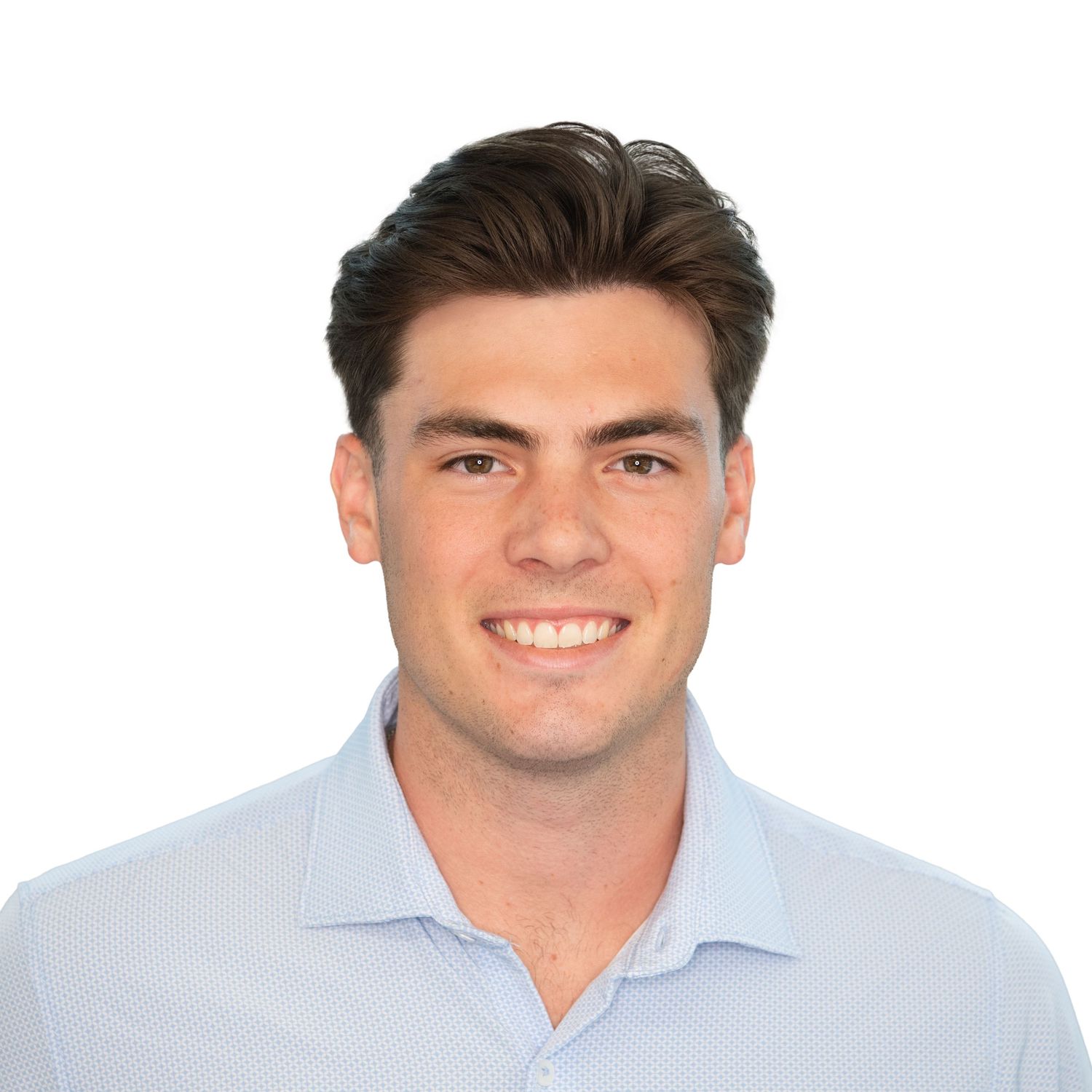 Professional headshot of someone wearing a light blue button-down shirt with a warm smile against a white background at EY by Leah Ramuglia.