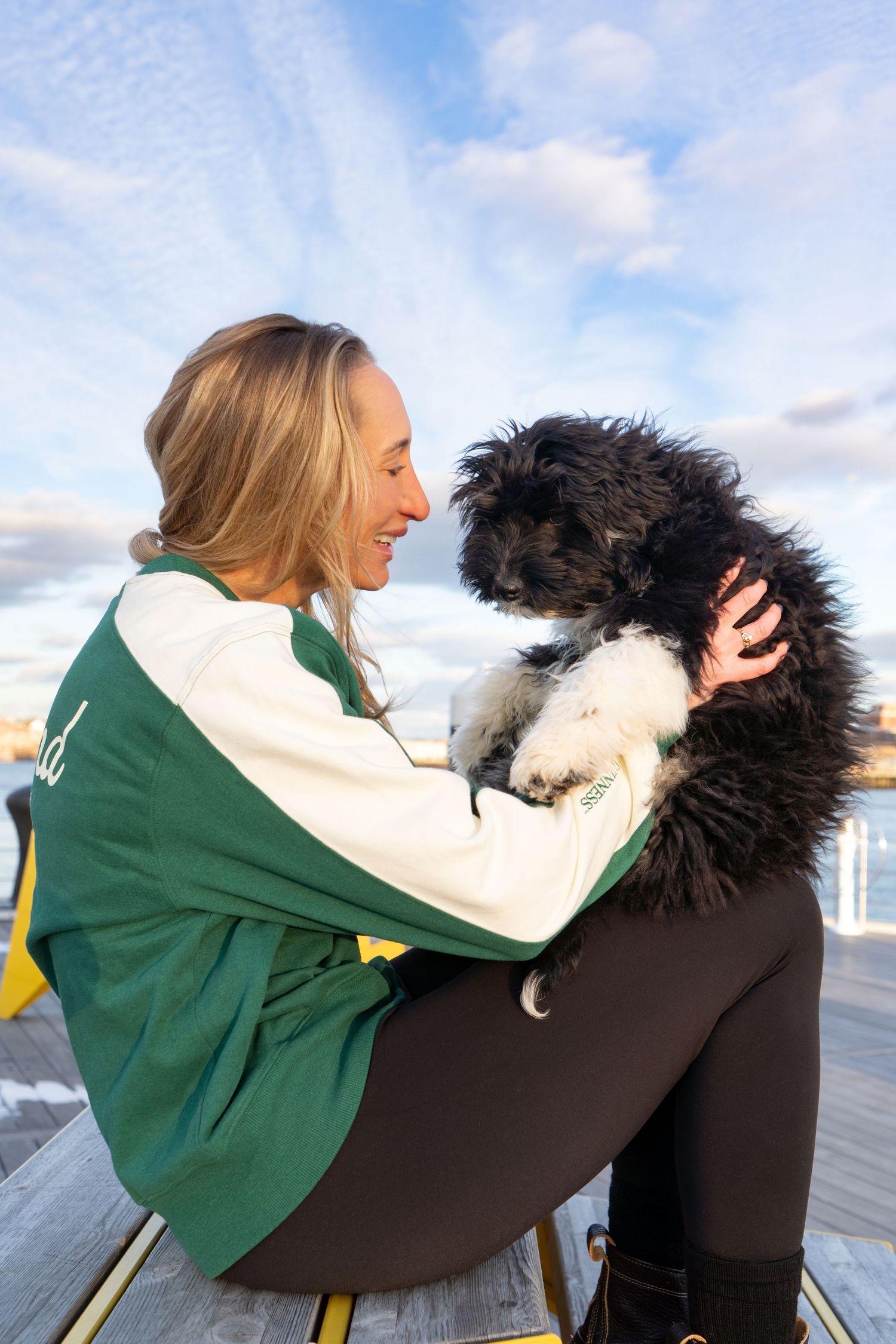 An Irish Water Spaniel Puppy photographed in Boston, MA by Leah Ramuglia Photography in the Charlestown Navy Yard.