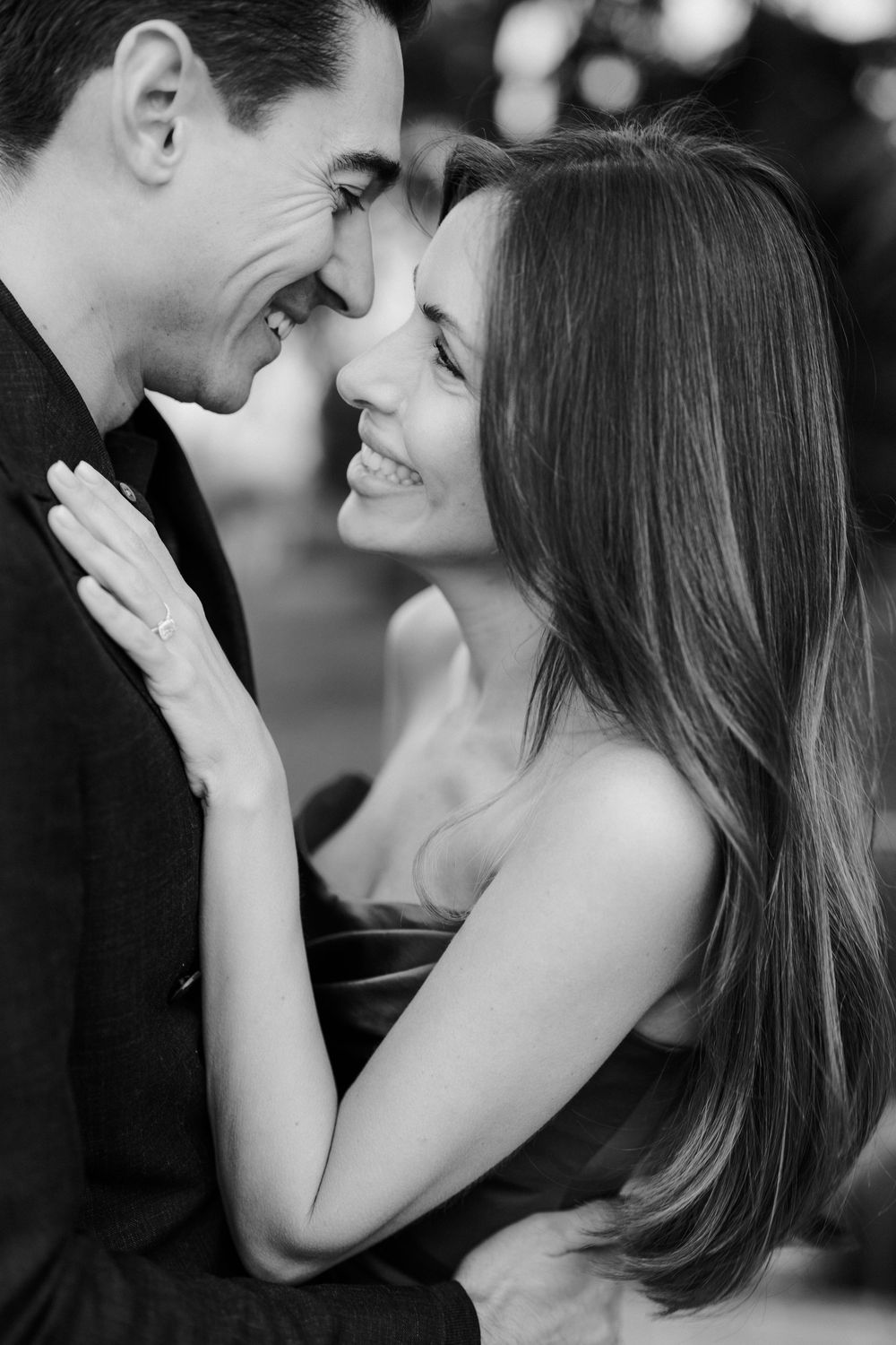 Black and white romantic photo sequence showing a couple sharing intimate laughing moments together.