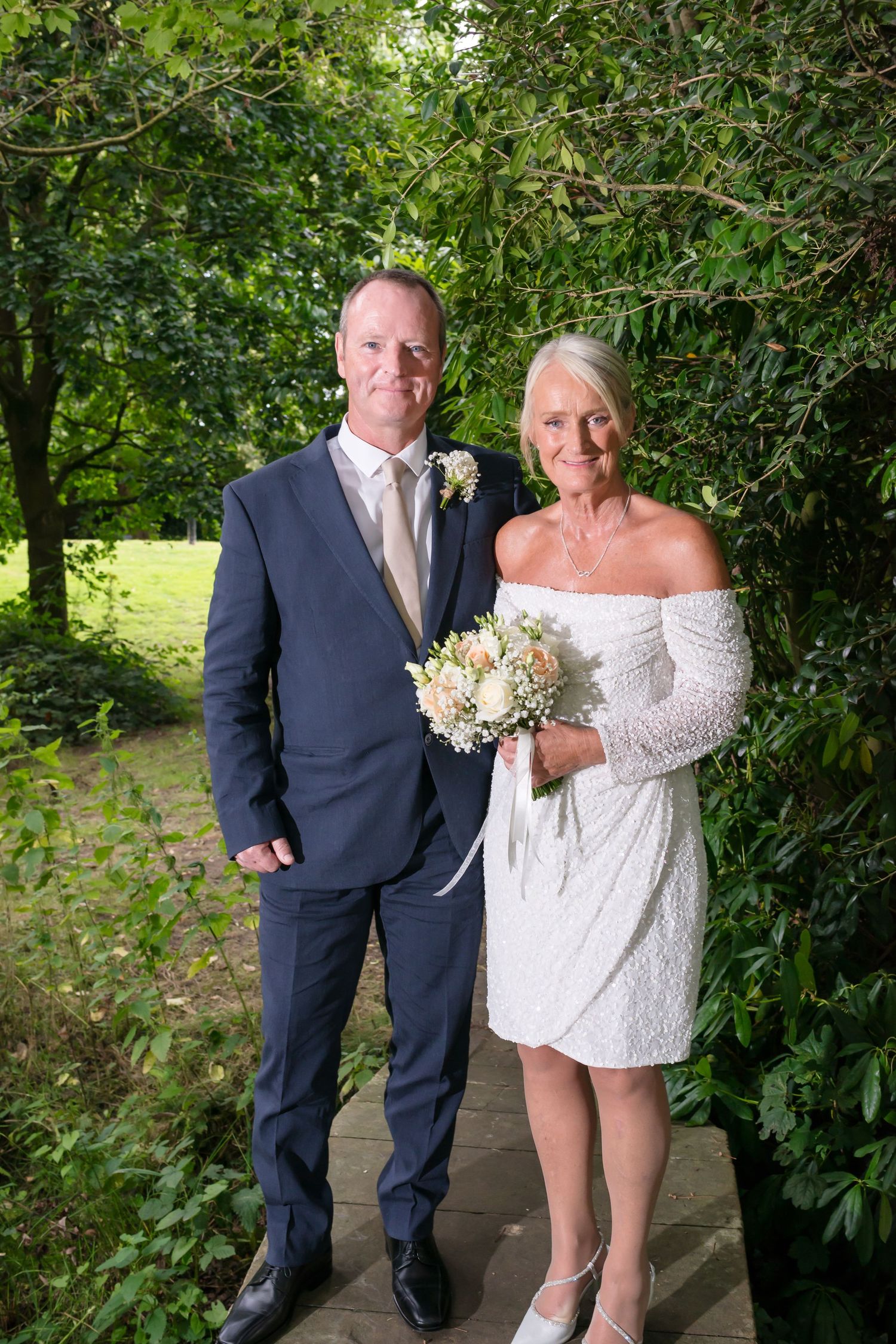 Elegant bride and groom portrait in the grounds of De Vere Cranage Estate; professional Cheshire wedding photography by Michael Pardoe