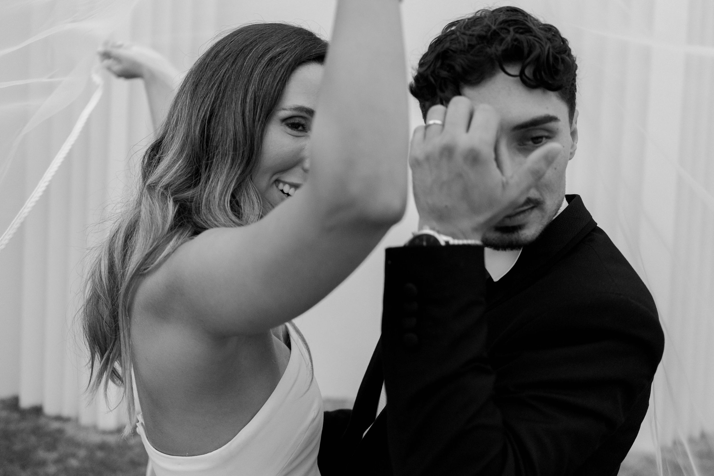 Black and white intimate moments captured during a wedding celebration.