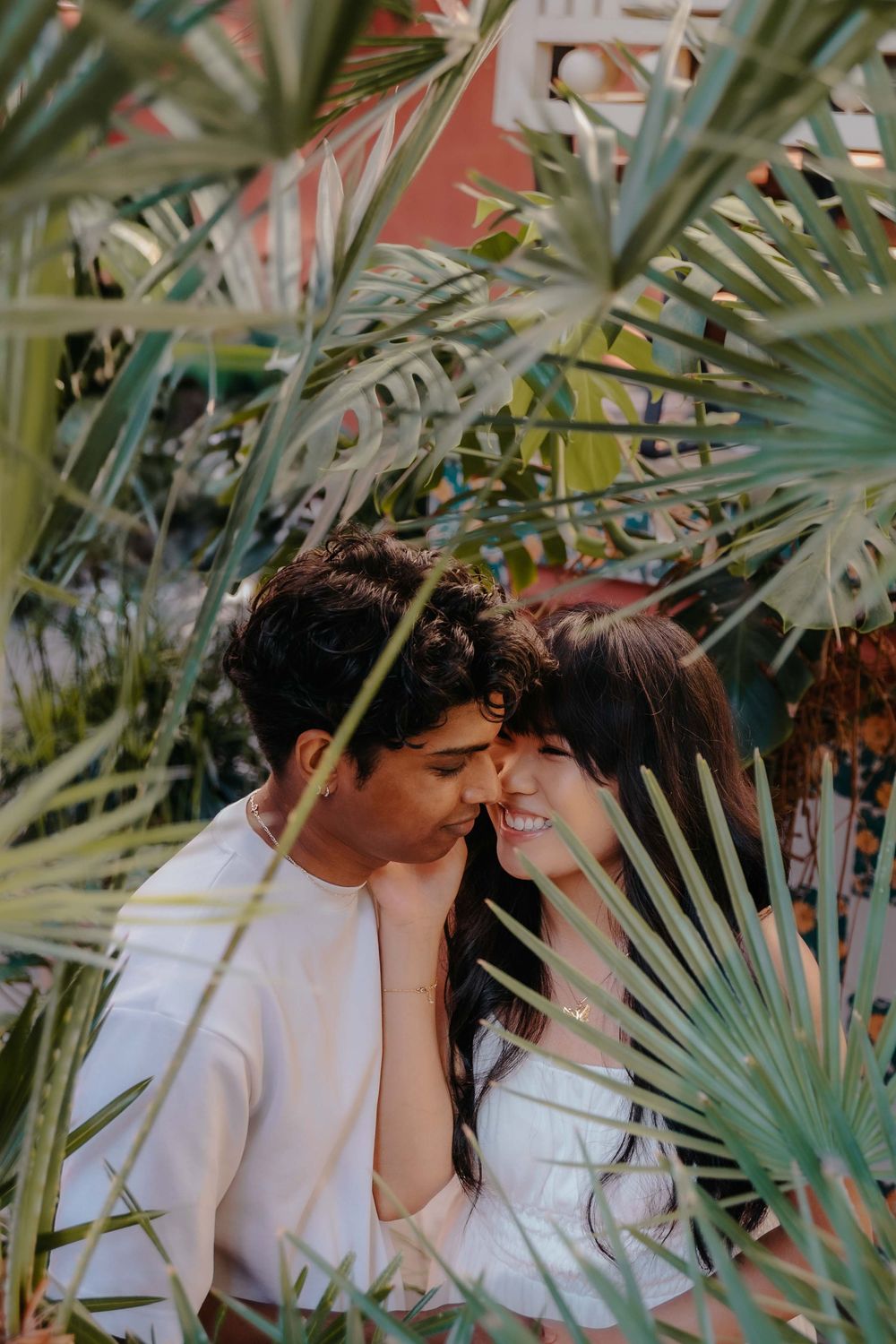 Varun looking at Lizelle with love and admiration in autumn light.