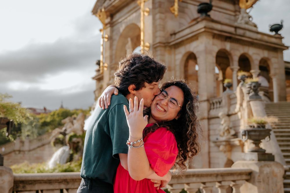 Couple laughing together after the shock of the proposal wore off.