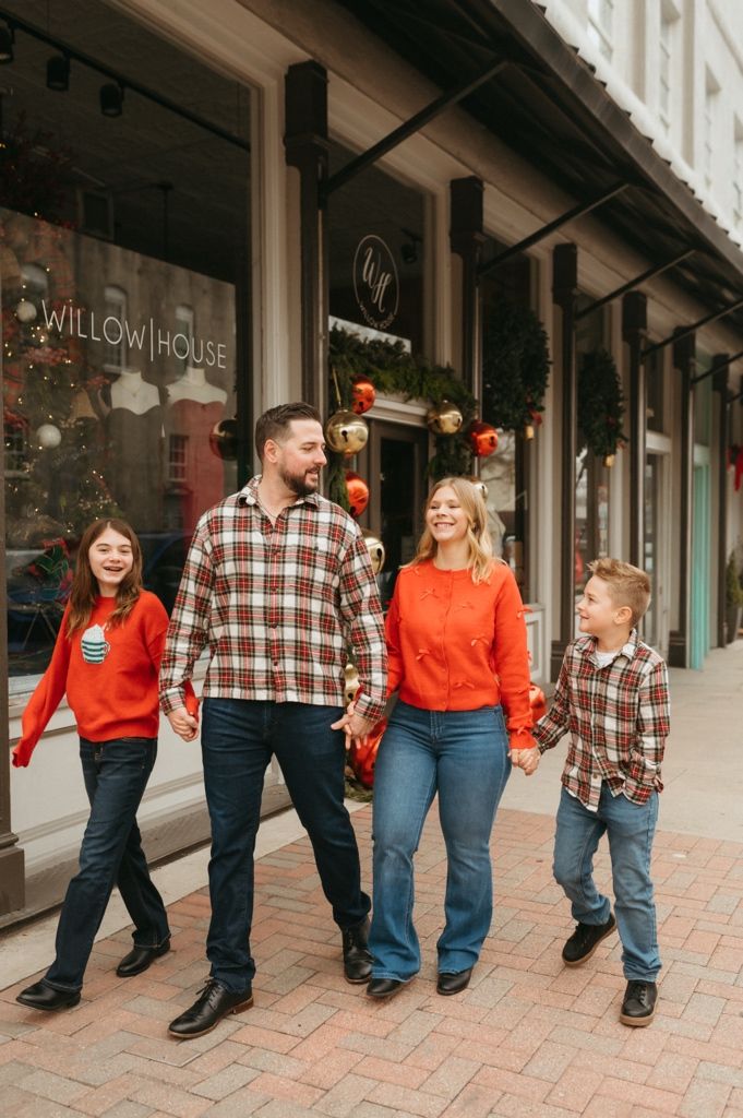 Progressive sequence of people walking and laughing together on a brick sidewalk during holiday season.