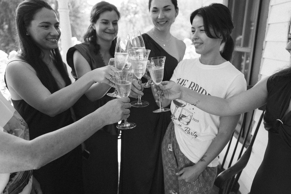 A black and white collage shows people toasting and celebrating with wine glasses at a social gathering.