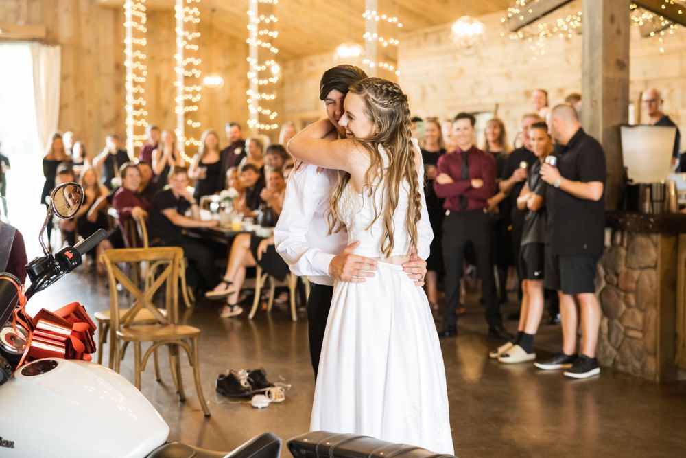 A series of wedding reception photos showing guests dancing and celebrating in an elegant venue with warm lighting.