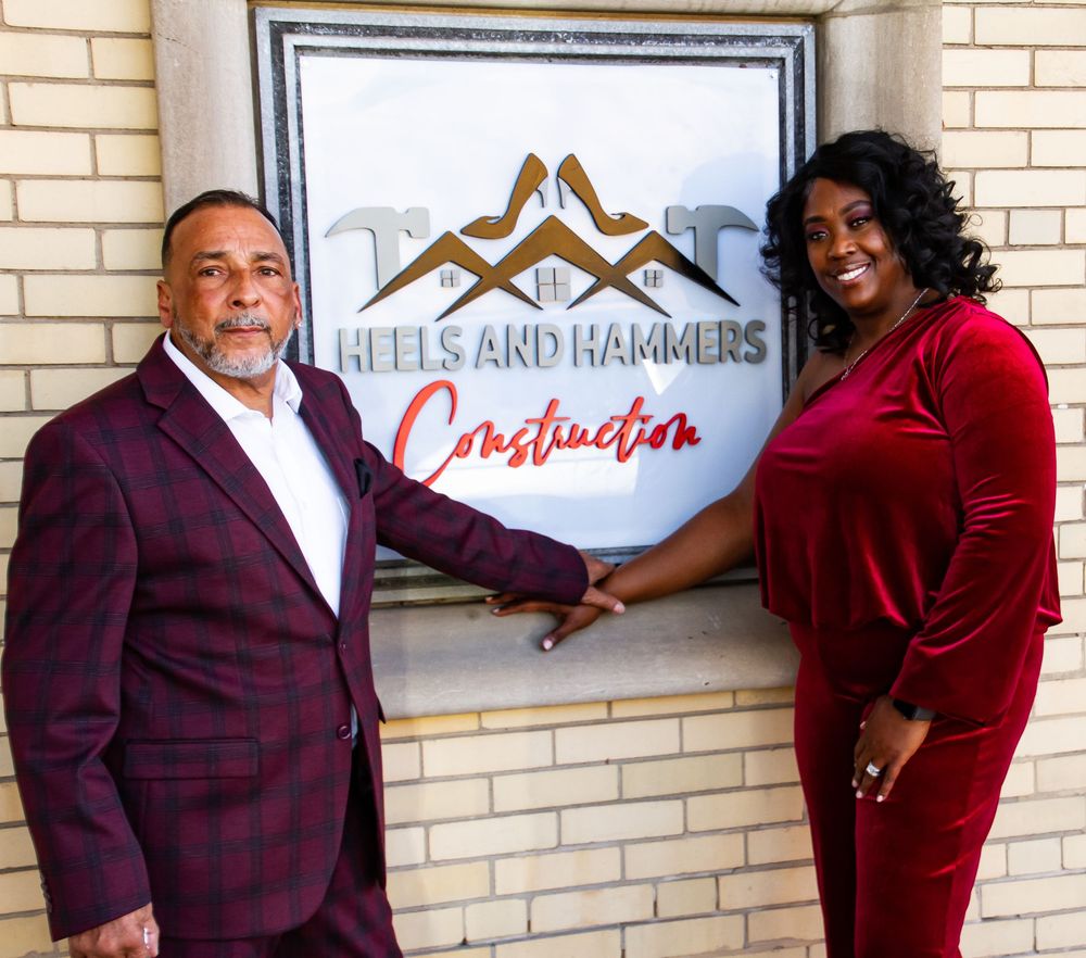 Owners with the sign