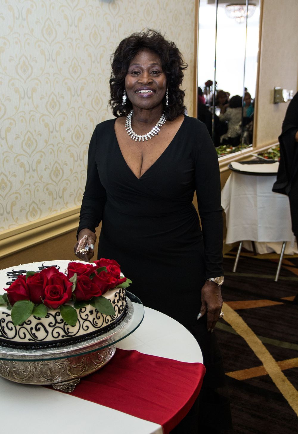 Professional shot of a beautiful lady in front of her birthday cake.