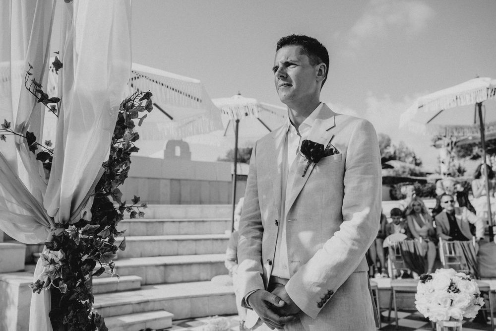 A series of black and white wedding photos showing a couple dancing and embracing at an outdoor reception.