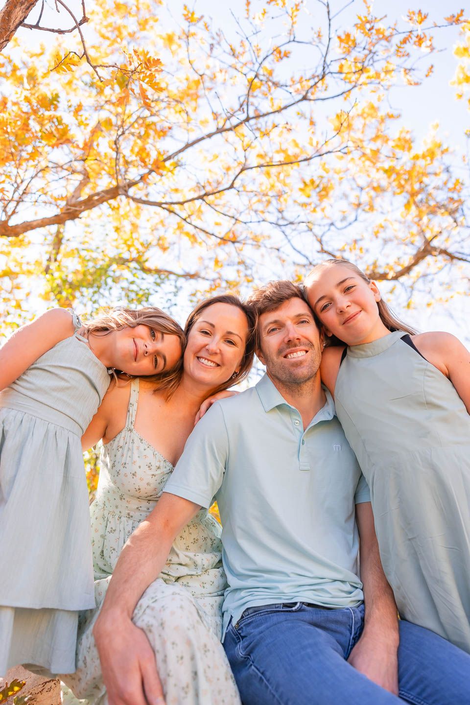 salt lake city utah family photographer, candid photo of a family having a messy snuggle in trees