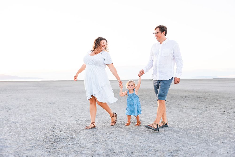 salt lake city utah family photographer, candid photo of a family walking at the great salt lake saltair