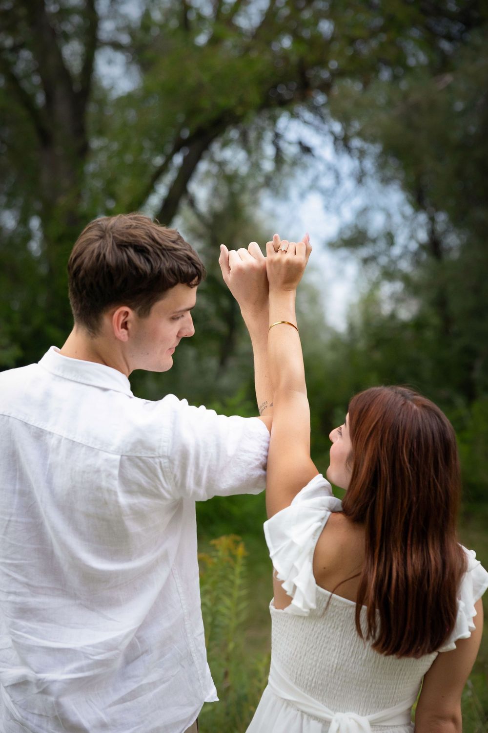 pinky swear with ring in focus