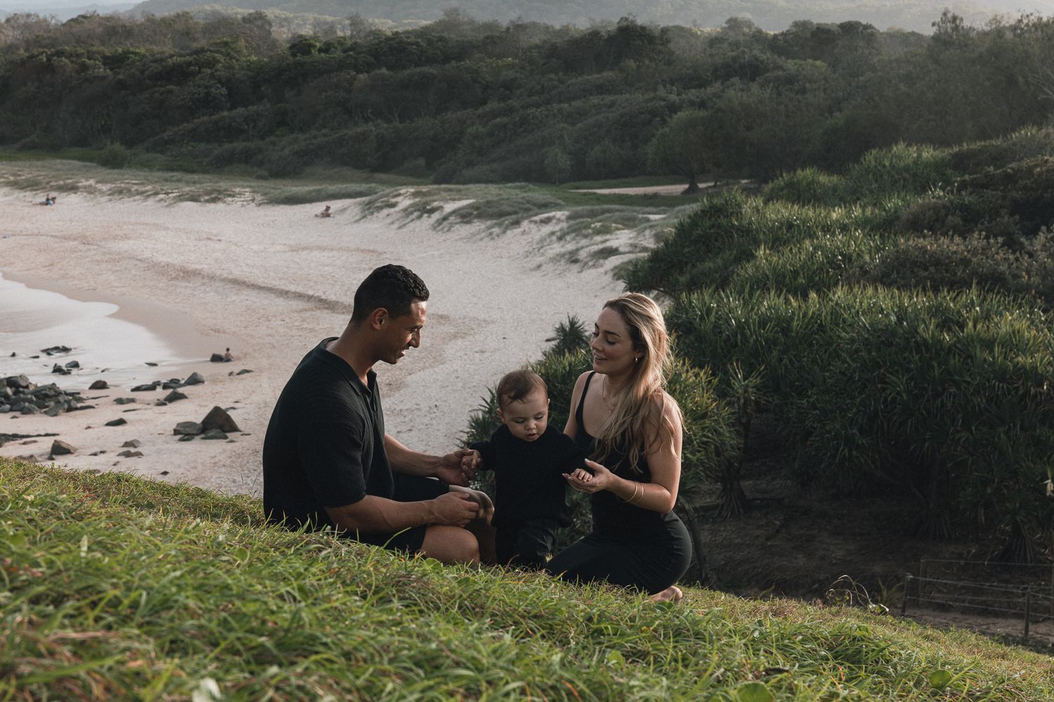 Candid family lifestyle photography at Cabarita Headland with sunset ocean backdrop