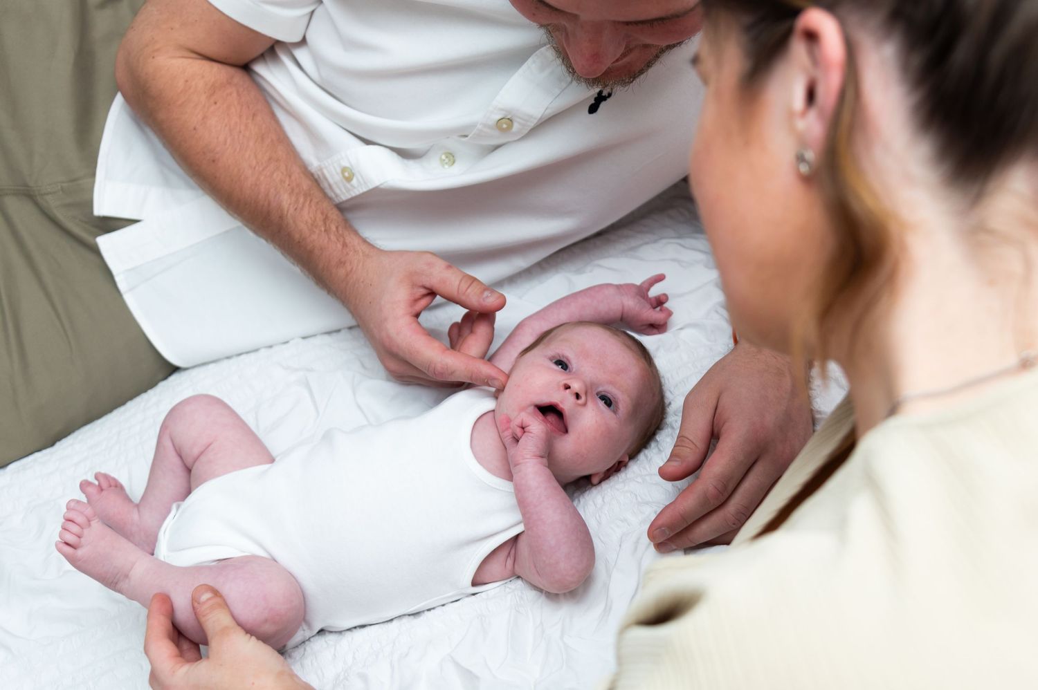 Series of baby massage therapy techniques being demonstrated on an infant.