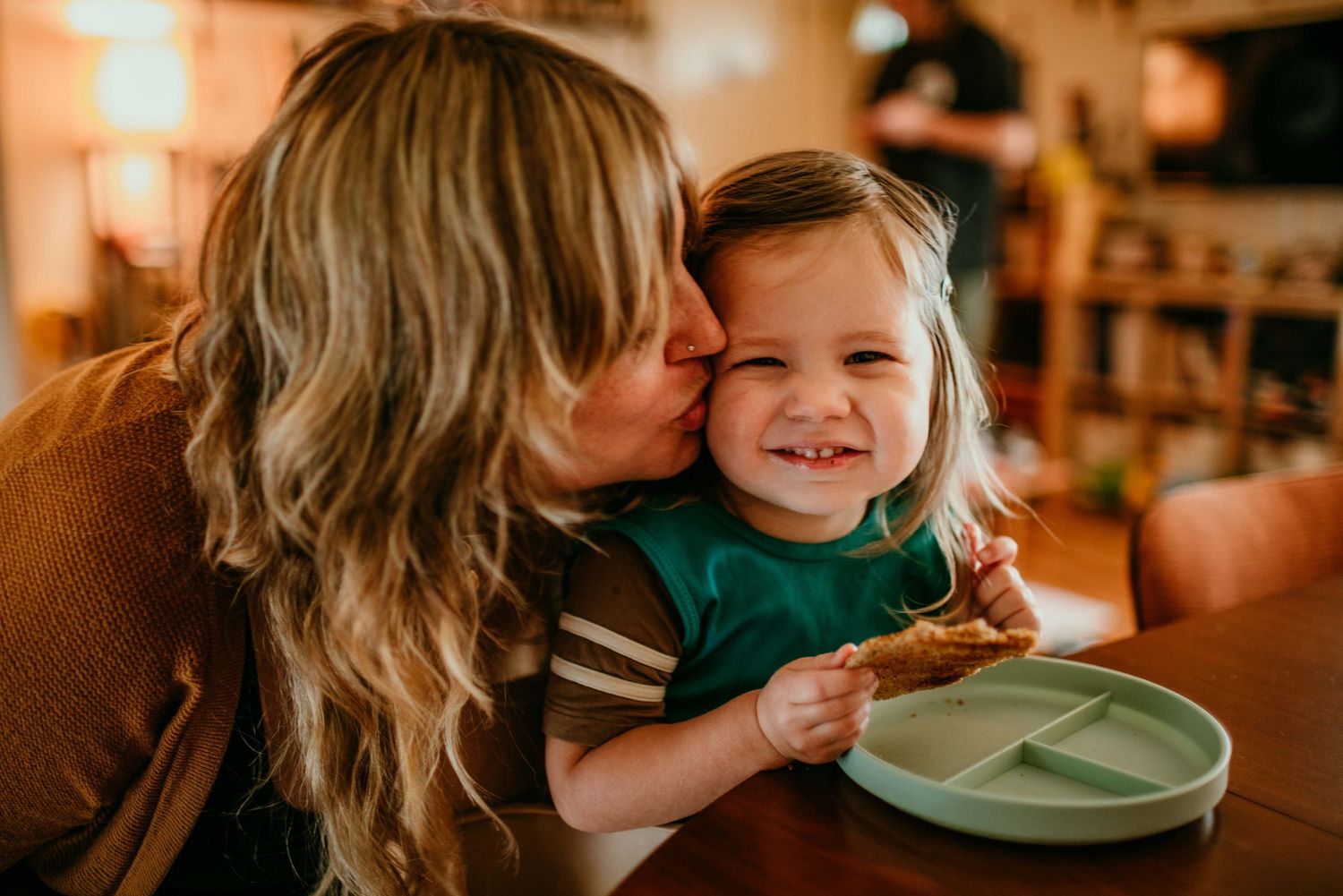 mother kisses child on cheek portland oregon family photography rushes & waves