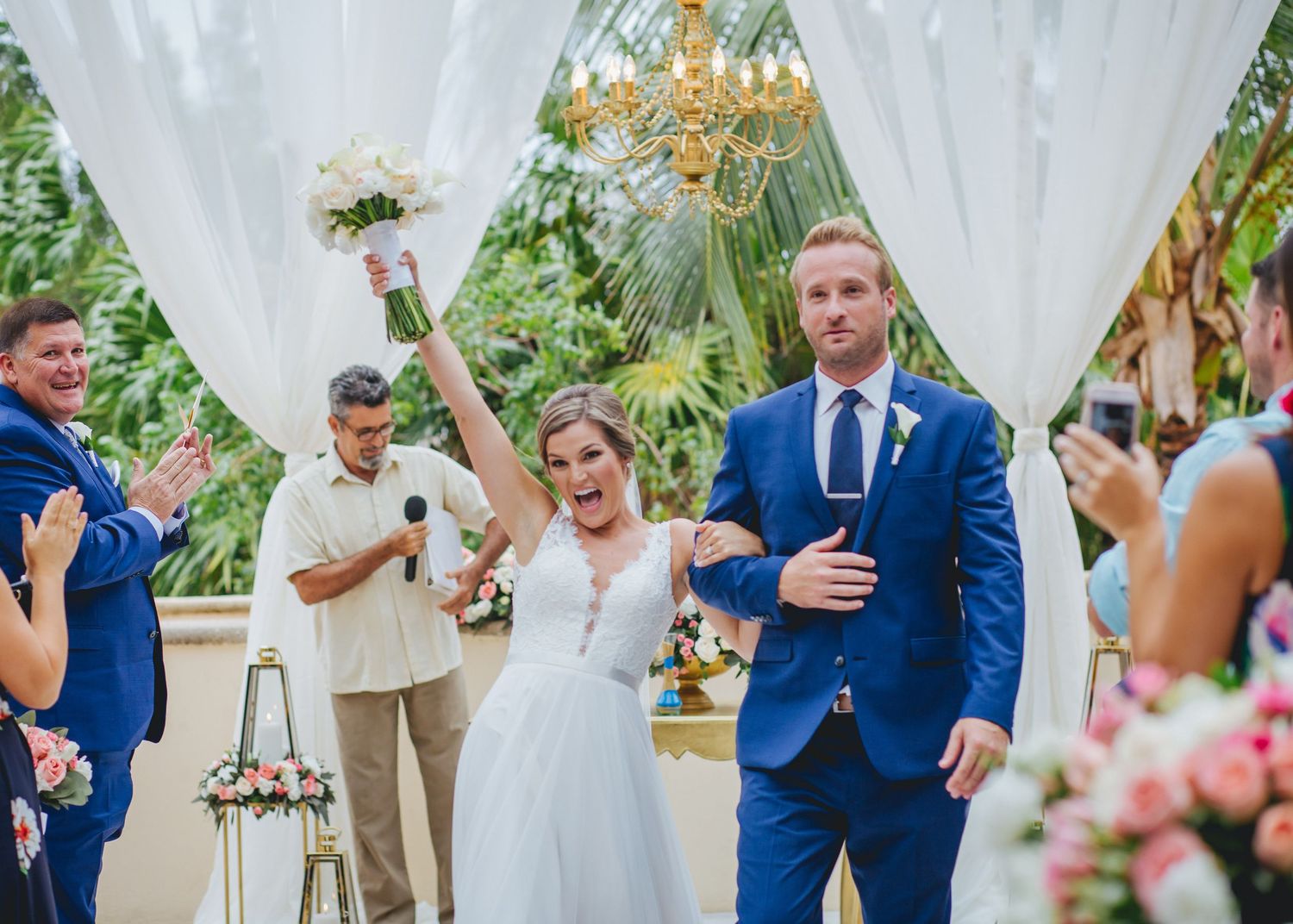 weddingceremony-weddingdress-brideandgroom-bluesuit-bouquet-chandelier-gazebo-altar
