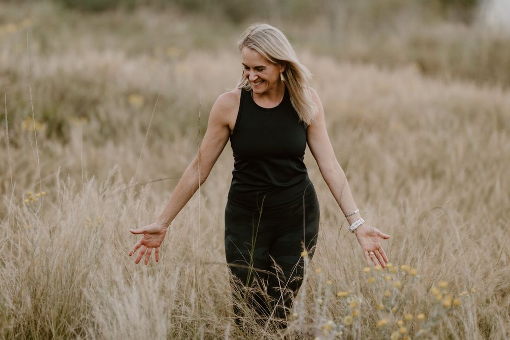wellness influencer walking in grass
