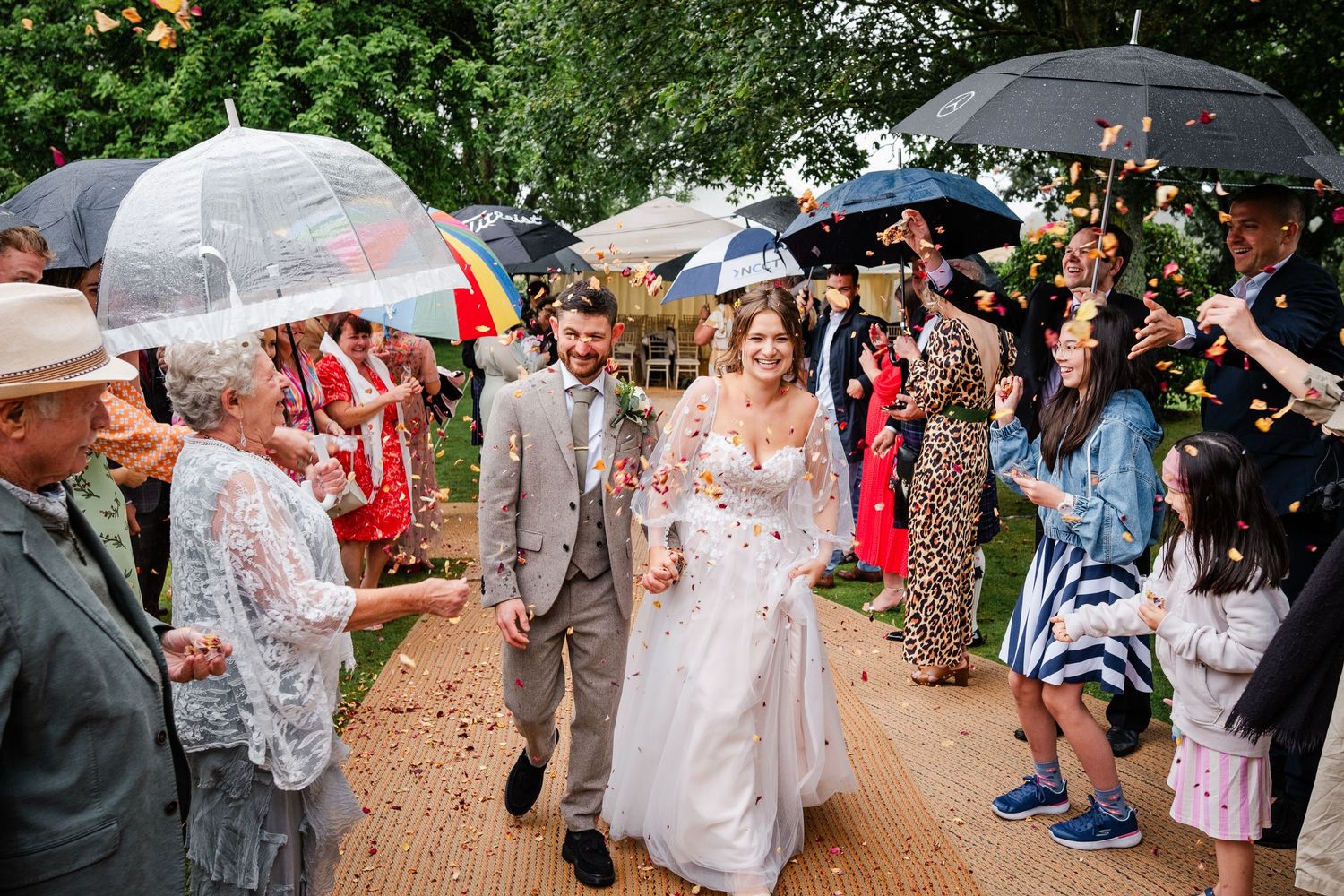 Confetti in the rain at a wedding in Kent near Ashford