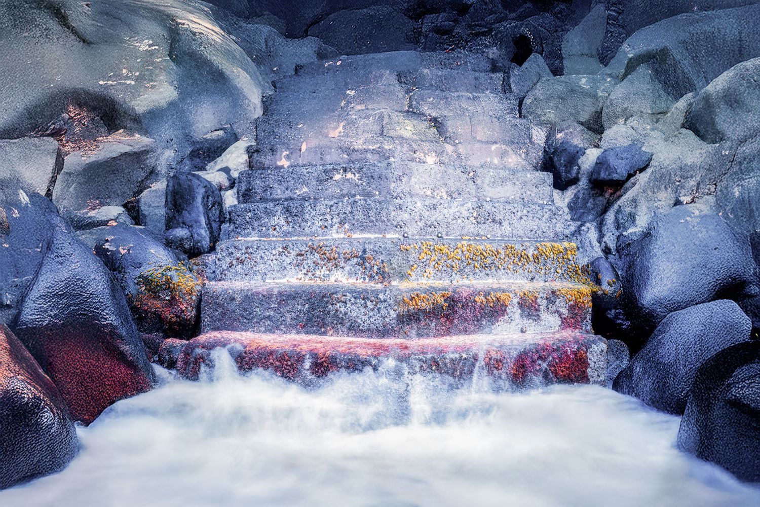 A mystical waterfall cascades through ice-covered rocks in a winter landscape, creating a dreamy blue atmosphere.