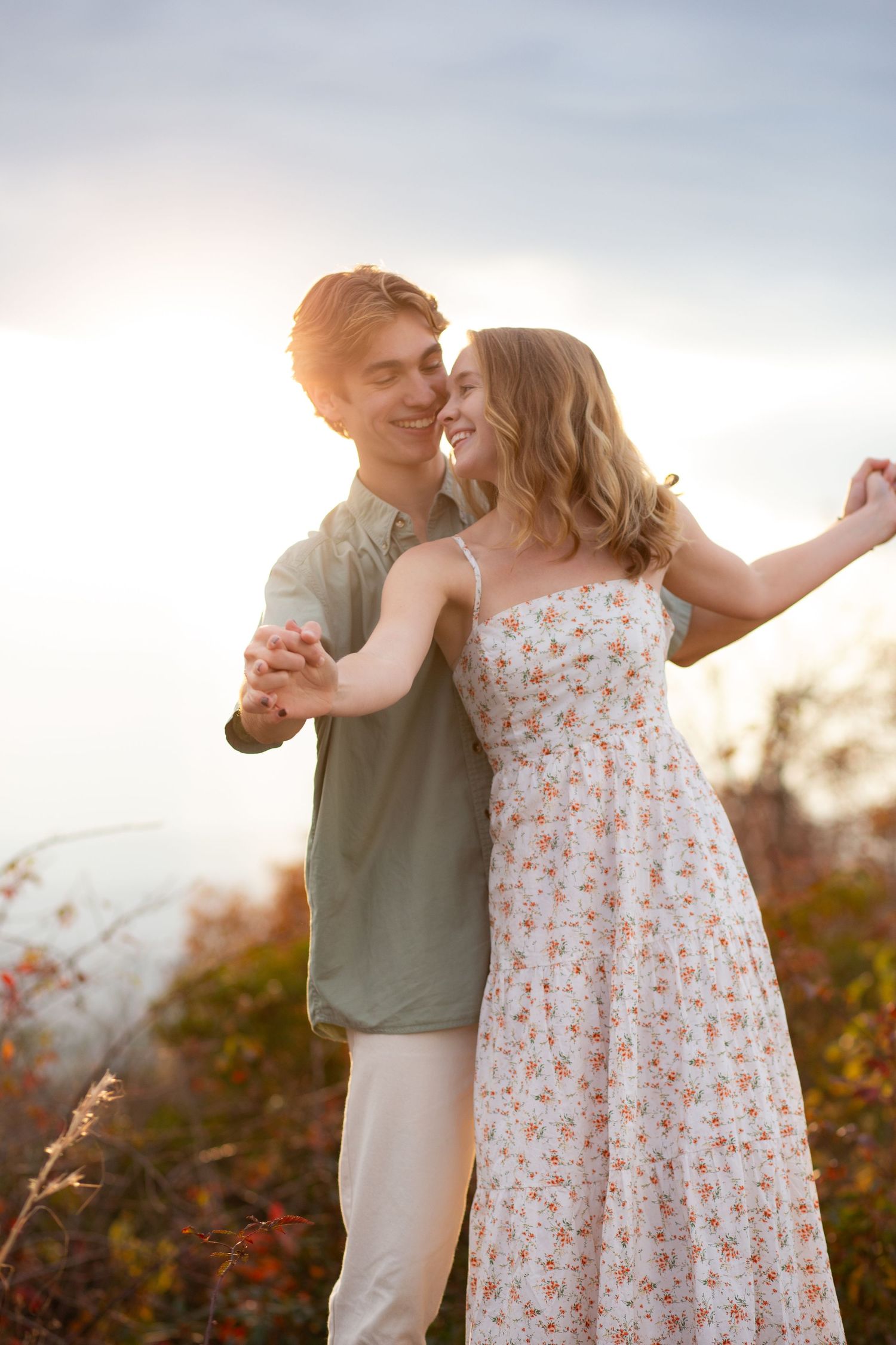 Two people in love dancing on top of a mountain at sunset |  Mount Sassafras Engagement Photos | Mountain Sunset Photos | Golden Hour Photos