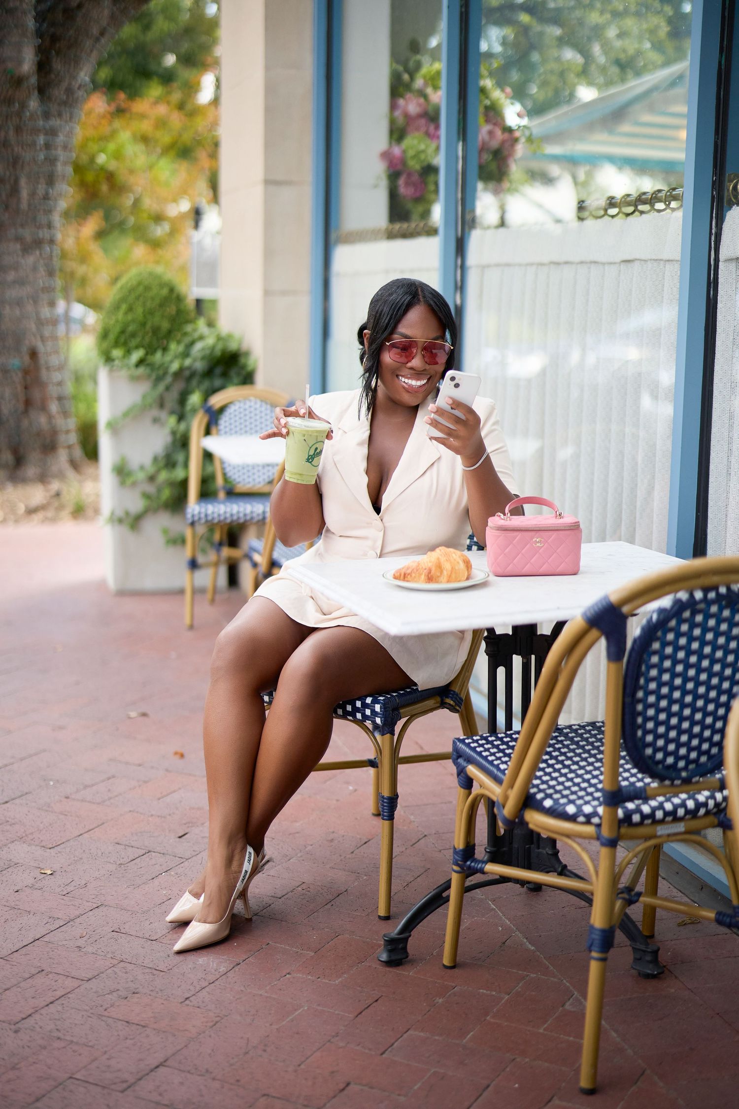 Casual outdoor cafe scene with bistro chairs and a relaxed dining atmosphere. Crystal Chanel