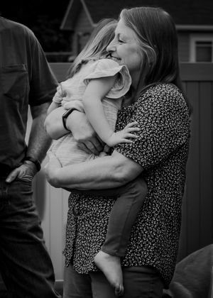 A tender black and white moment captured between a grandparent and young child unplanned special moments Chouteau County family photoshoot