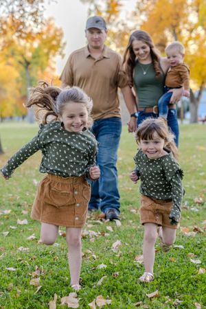 Loving family sharing laughter outdoors in autumn photoshoot Fort Benton Montana Chouteau County Great Falls candid special photography