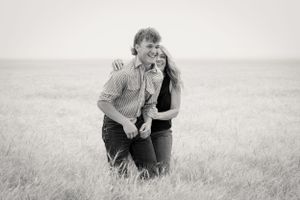 Senior photoshoot of laughing family turns to mom and son candid photos for office or home walls in Chouteau County photography