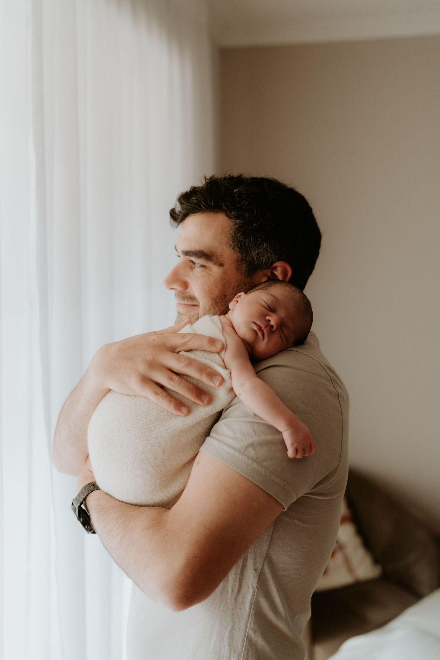A natural family photo of a father and his newborn at home on the mornington peninsula
