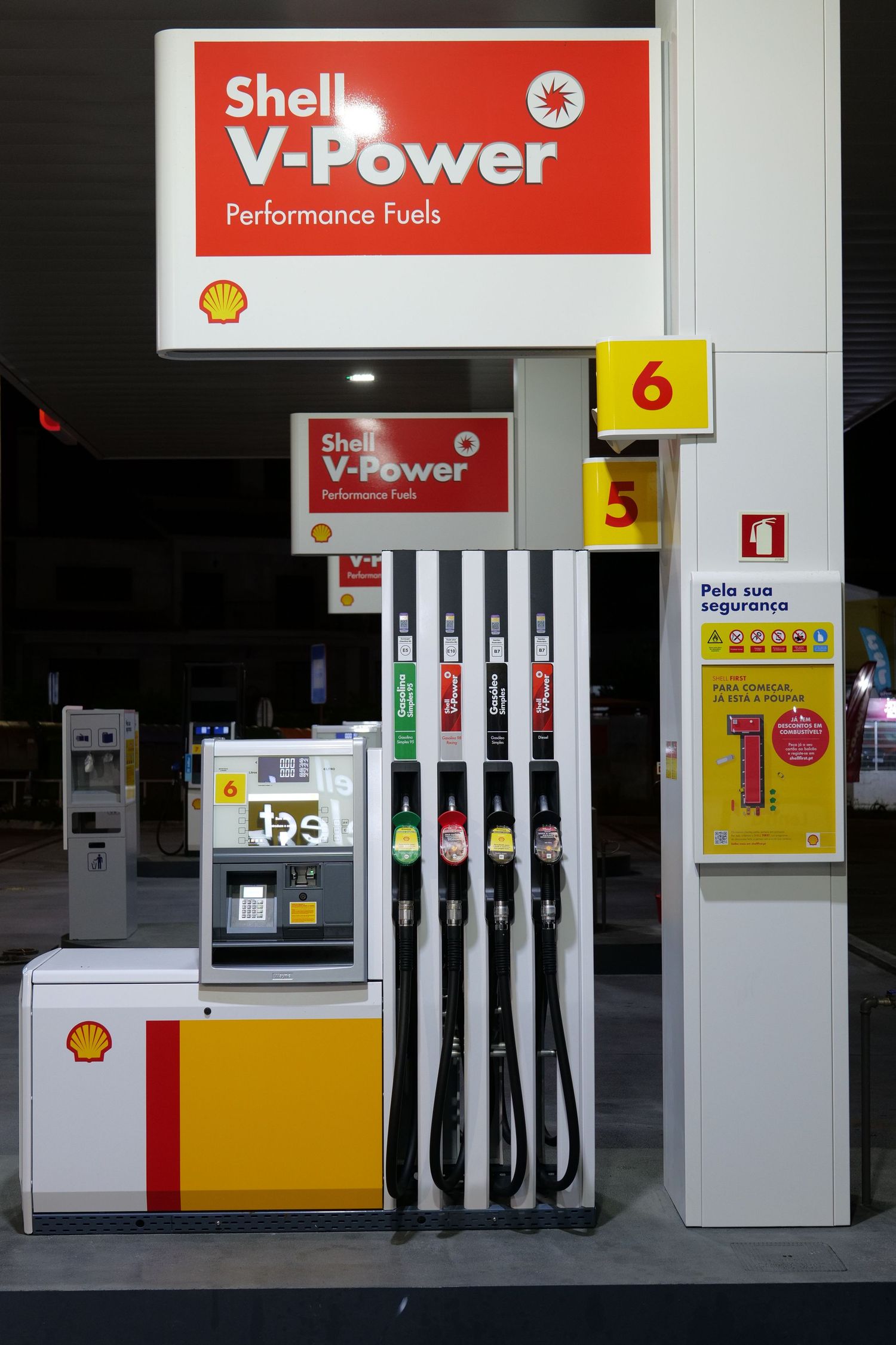 Shell V-Power Performance Fuels pump station with multiple fuel nozzles at pump 6.
