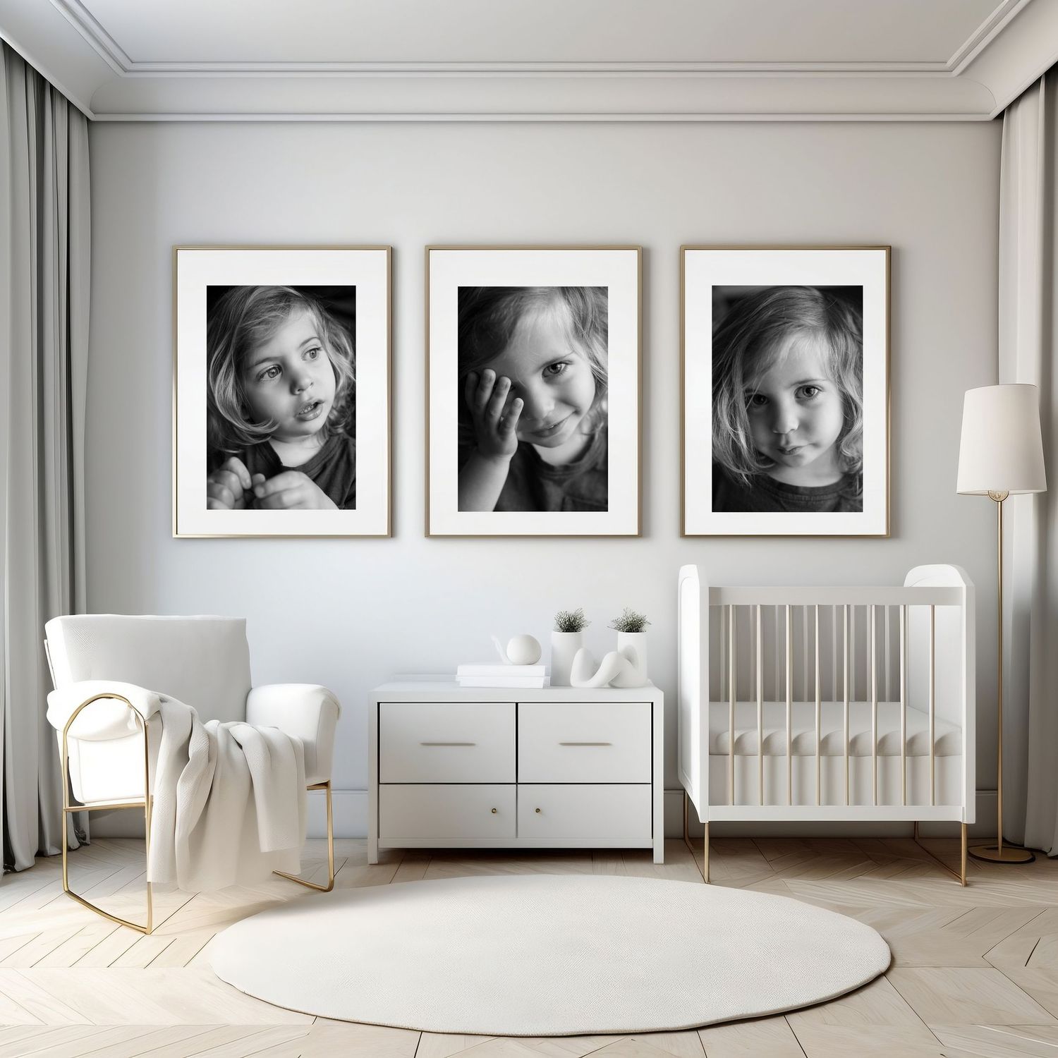Modern white nursery room with three black and white portrait photographs on wall above dresser and crib.