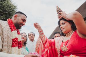 Traditional Indian wedding ritual captured during outdoor ceremony.