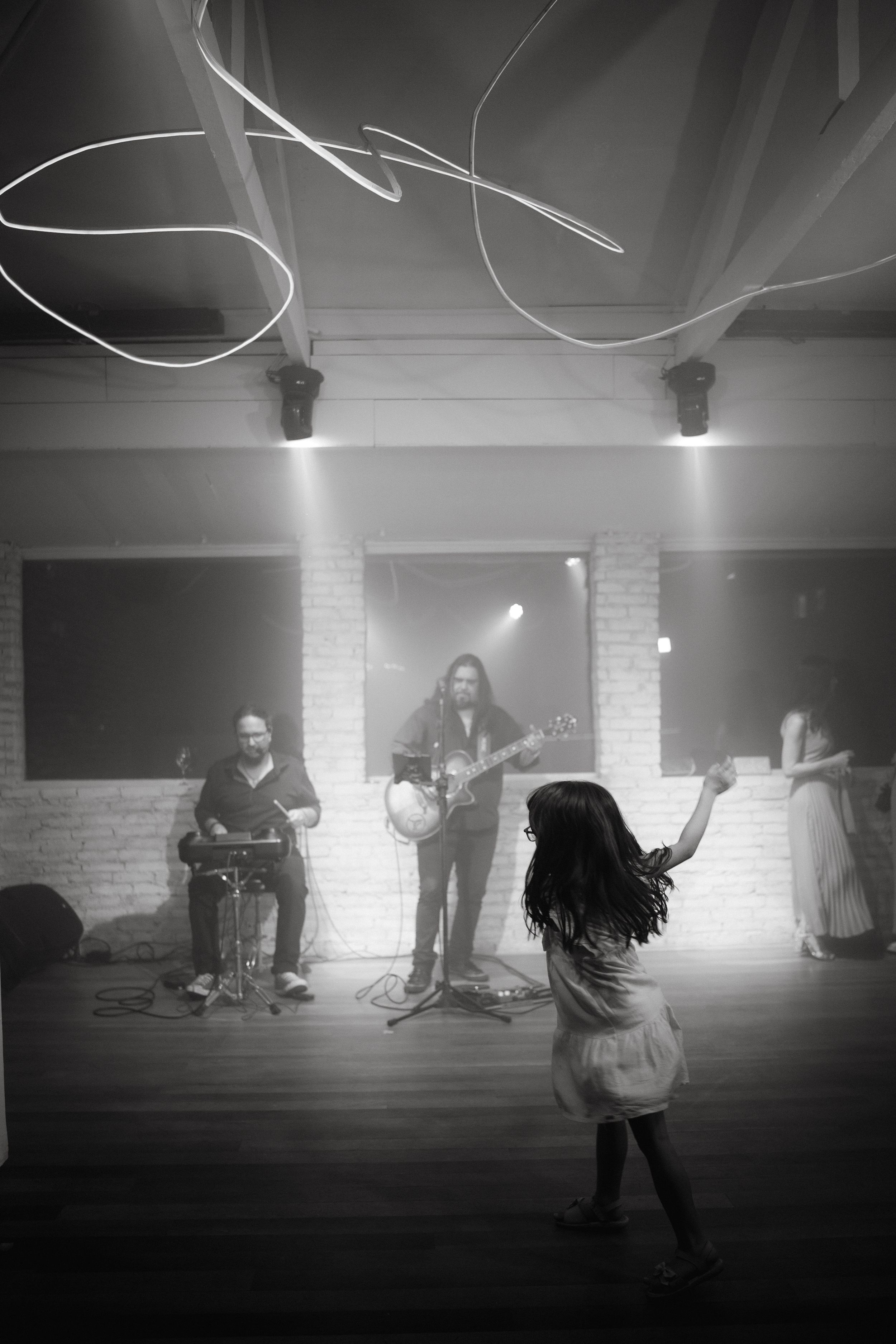 Live band performing while guests dance at a wedding reception.