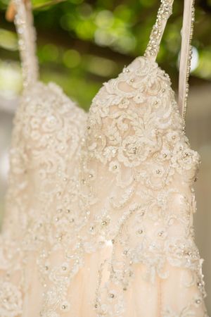 Close-up of an intricately beaded and lace wedding dress bodice.