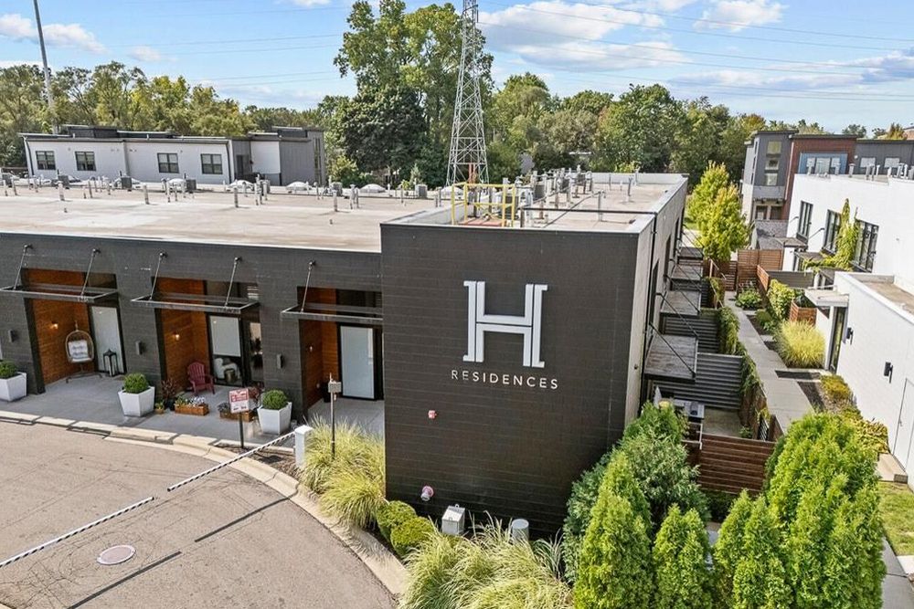 Aerial view of modern H Residences townhome complex with contemporary architecture and landscaping.