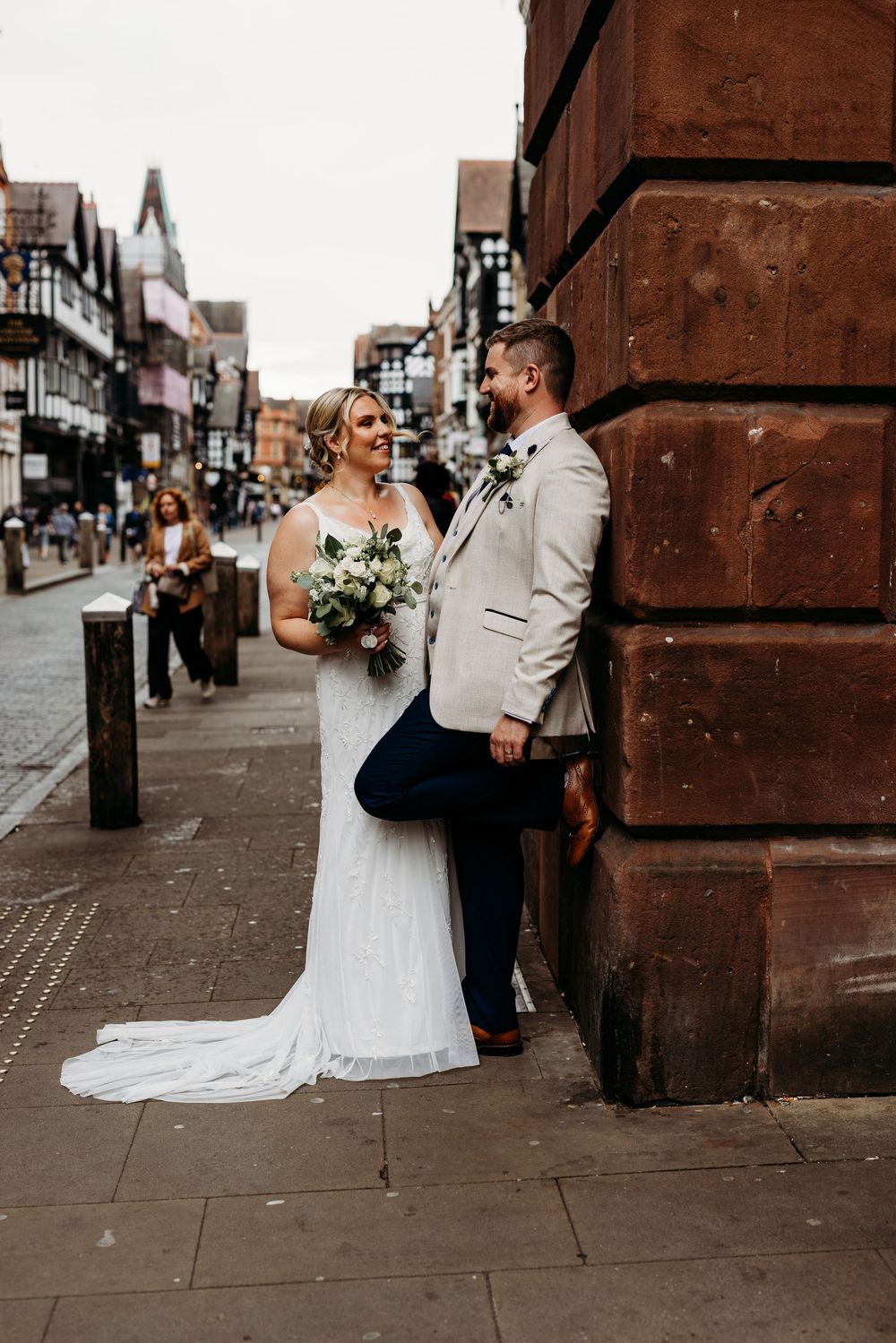 Romantic street scene with Tudor-style architecture in historic city center.