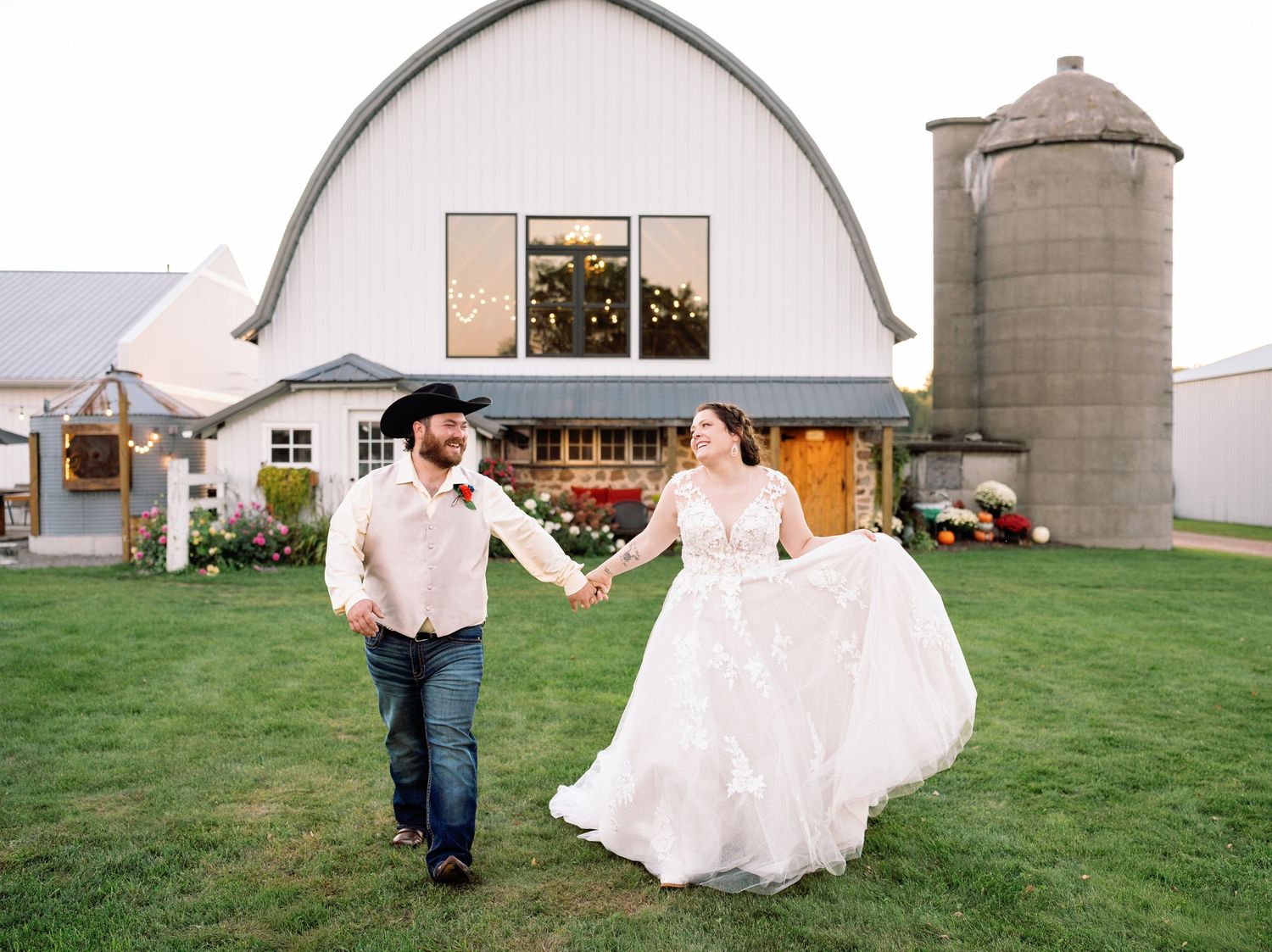 Wedding photos captured against rustic barn and silo backdrop in countryside setting.