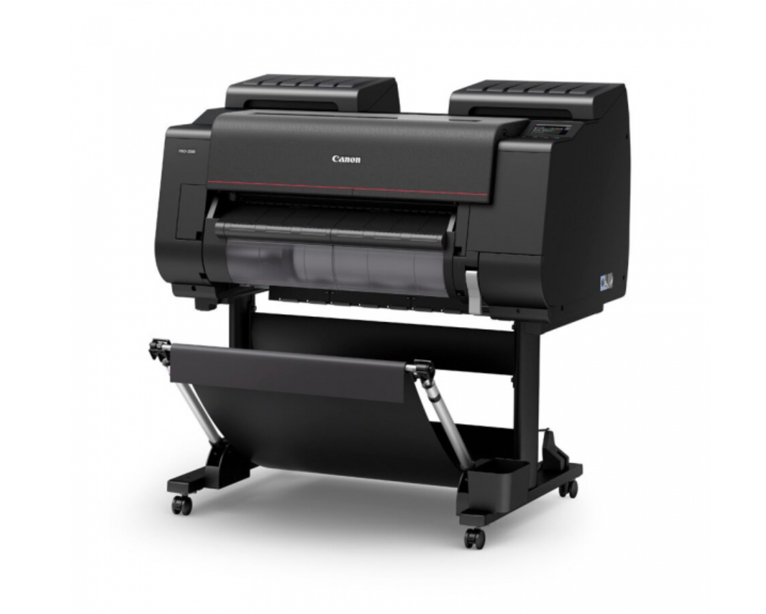 Row of large format Canon photo printers in a professional print studio.