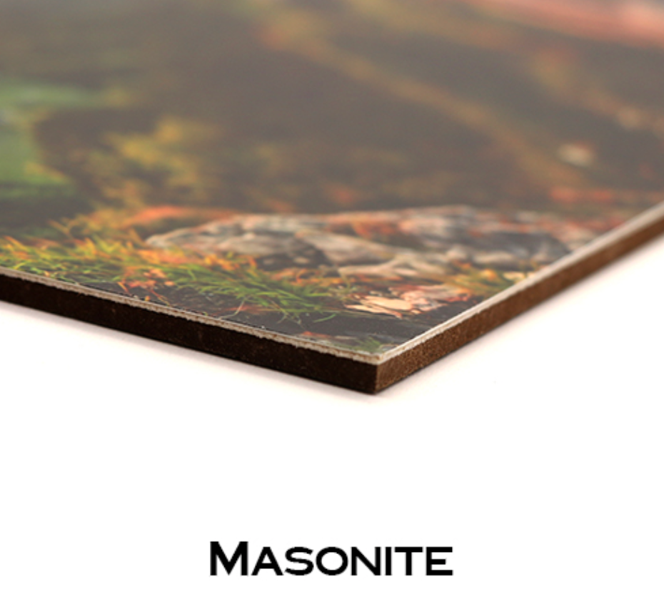 Wedding photographs displayed on wooden boards showing masonite material close-up.