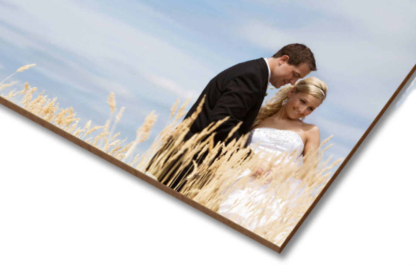 Wedding photo printed on layered masonite boards displayed at an angle.