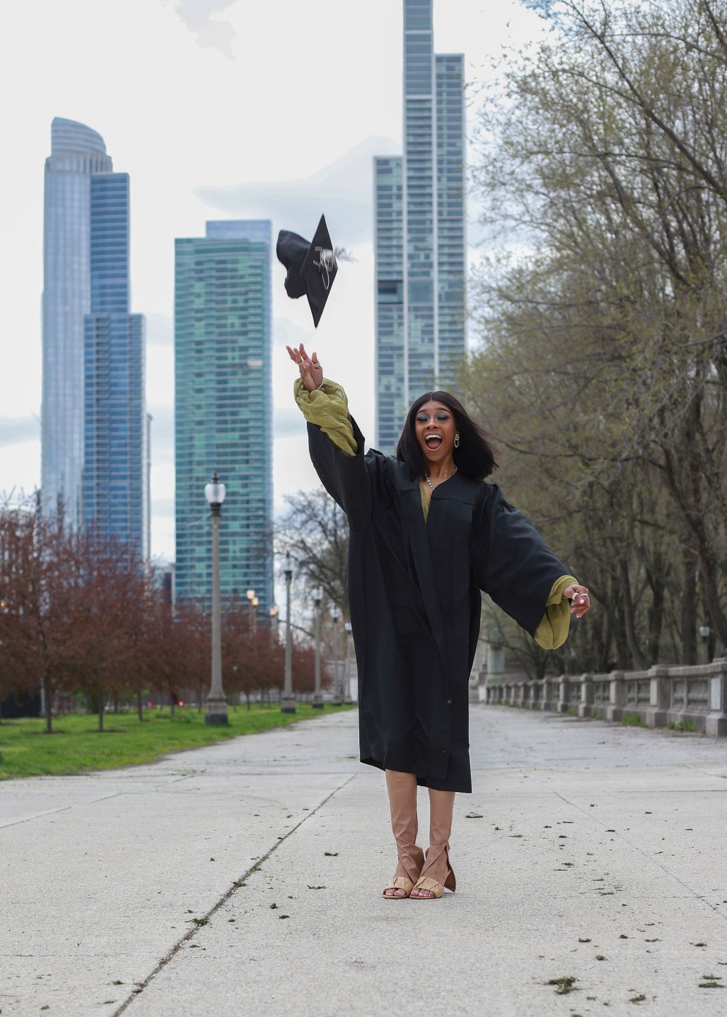 Picture of a graduate tossing their cap into the air.