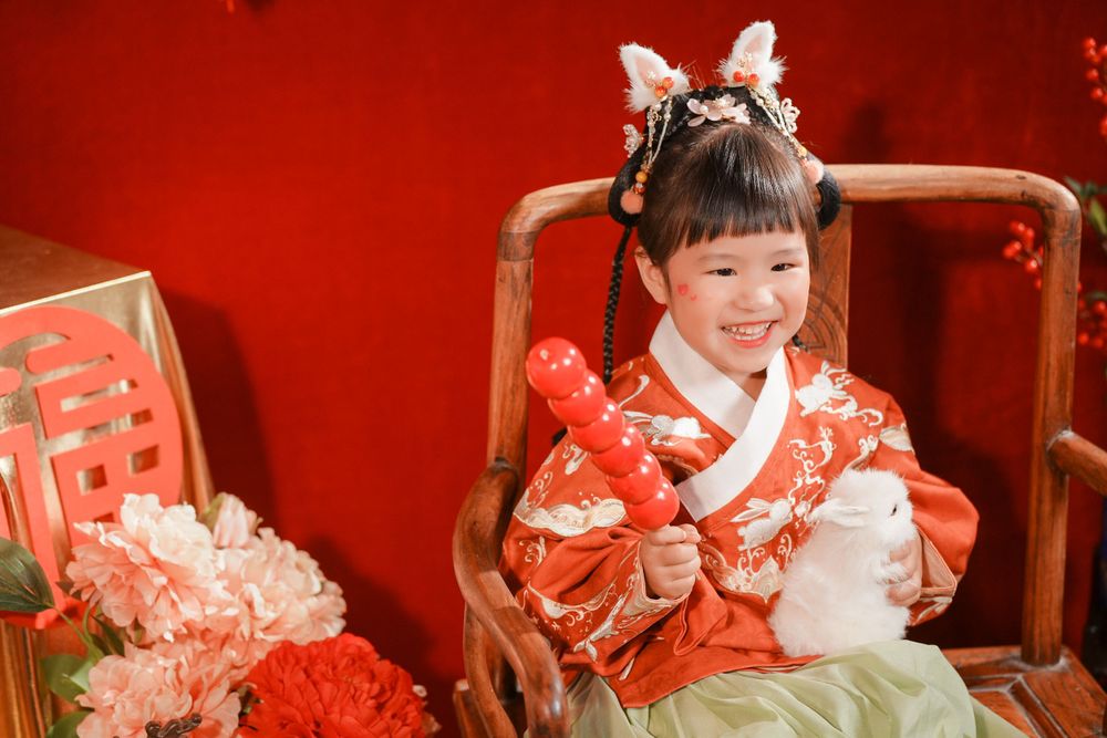 Adorable kids studio portrait featuring a cute child in traditional Ming Dynasty Hanfu, by Imagine Image Studio Auckland.