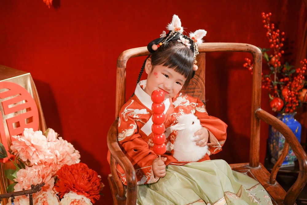 Adorable kids studio portrait featuring a cute child in traditional Ming Dynasty Hanfu, by Imagine Image Studio Auckland.